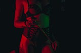 A dominatrix body — no face shown