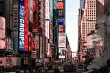 Many people visit Times Square for its bright lights.