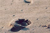 Footprints on sand.