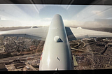 Photo of a plane wing through the window