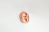 An ear on a white background representing audio and the ability to hear