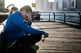 Picture of a man resting on a bench.