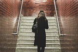 woman walking up steps