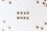 Scrabble tiles with “Read More”.