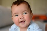How do Babies Learn to Smile?