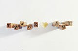 the word thank you in wooden blocks on a white background