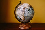 a world map globe with a serene background