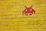 yellow brick wall and pixelated game character