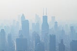 Shanghai cityscape. Pollution casts the buildings in a dismal, monochromatic haze.