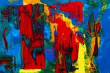 An abstract painting of red, blue, green, and yellow.