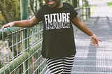Photo of a very young girl wearing a t-shirt that says “Future Leader”