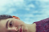 A young child looking sideways.