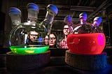 2 colored beakers in a science experiment.