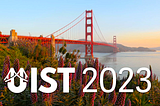 An image with a large title that said “UIST 2023” in the foreground, and in the background you can see the golden gate bridge, the sky is clear and the sun is just setting a little behind the bridge, giving the plants in front of the bridge a warm glow. Light fog over the water.