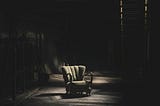 Solitary chair in an abandoned house