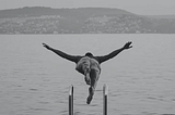 Man diving headfirst into a lake