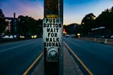 Push button wait for walk signal — Photo by Ashim D’Silva on Unsplash