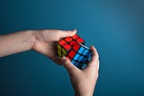A person solving a Rubik’s cube.