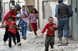 Afghan children seek refuge after hearing the blast