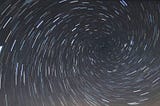 Vortex startrail created by single image of clear sky. Photo by Mohdammed Ali on Unsplash