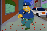 Chief Wiggum backs away screaming and shooting at a virus (The Simpsons).