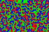 The Belousov-Zhabotinsky Reaction from thermodynamics, swirling red, green and blue shapes.
