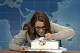Tina Fey stuffs her face with cake using a fork