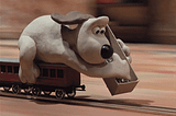 Gromit from ‘Wallace and Gromit — The wrong trousers’ laying tracks ahead while the train is moving at full speed