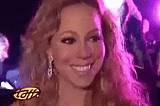 Mariah Carey shaking her head and saying, with a smile, “I don’t know her”