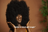 beautiful Black woman smiling with a big afro. text says “smiles in Black girl magic”.