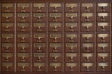 an antique wooden card file from a library. Medium table of contents