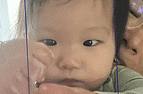 Early render of image alignment, with babies faces surrounded by a blue outline.