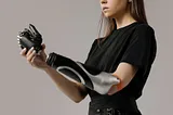 A girl with a bionic arm signifying how technology is being integrated with humanity.