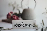 Welcome sign in cursive writing