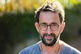 An anxious man pretends he’s okay by putting on a brave face