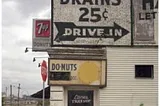 Sign on a corner store that reads Brains 25 cents