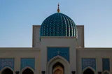 The writer pictures a mosque in the Middle East.