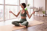 woman sitting on a yoga mat