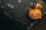 A toy cat with an angry face