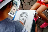 Artist drawing a pre-teen girl.