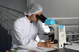 man with microscope