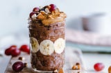 Glass jar filled with fruit, nuts, etc.