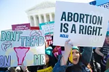 Pro-choice activists protest during outside the US Supreme Court on March 4, 2020.