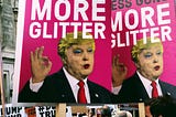 protest signs with an image of Donald Trump in drag: Less Guns More Glitter