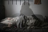 An image of a woman in bed under sloppy covers with a superimposed image of a woman sitting up in bed and looking up. The impression given is that of a sleepless night.