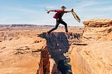 A person jumping from one ledge to another with intrinsic motivation