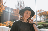 Alex Lilly poses outside on a fall day.