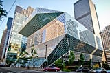 An exterior shot of the Seattle public library building.