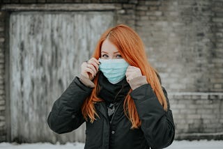 A woman wearing a mask in pandemic