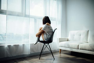 A woman looking out a window